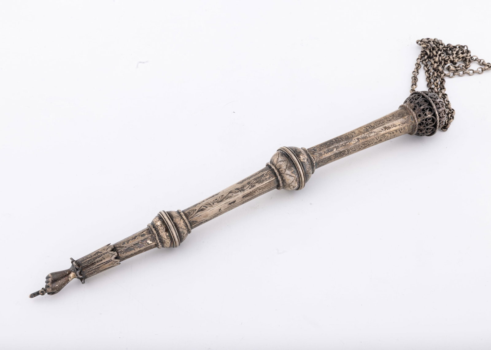 AN IMPORTANT SILVER TORAH POINTER. Poland, c. 1801: Comprised of three sections connected with spherical adornments. Futher decorated with a cuff and fitted with a ringed hand pointing downwards at termination. Engraved in Hebrew: THIS WAS DONATED BY T