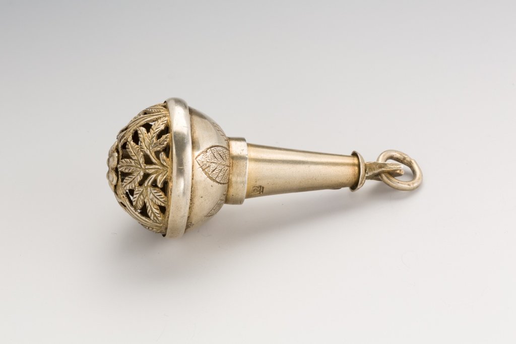Silver Parcel-Gilt Traveling Spice Container: Silver Parcel-Gilt Traveling Spice Container. Probably Poland, 19th century. With floral piercing on the hemispherical underside. Suspension ring. 3 inches (7cm.) tall. Estimate $1,000 – 1,500