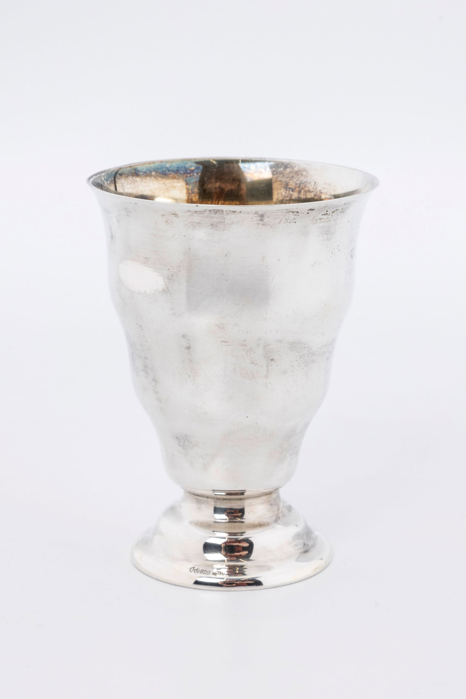 A SILVER KIDDUSH CUP. Germany, c. 1910: Art Deco in formation. On a round domed base with an outwardly tapering upper portion. 3.5" tall and 73.9 grams.