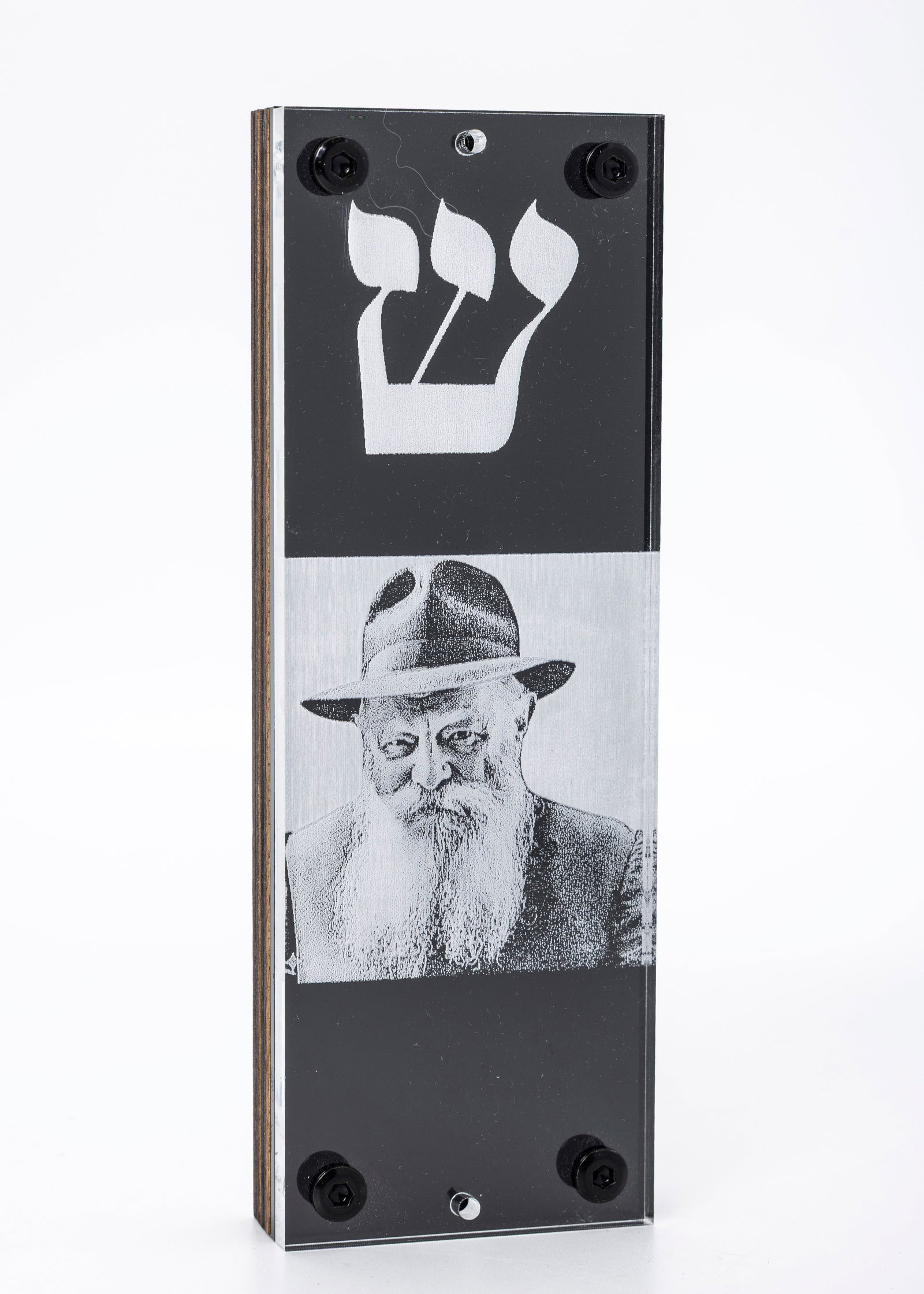 A CHABAD REBBE MEZUZAH CASE (COVER): United States, modern. Depicting a picture of the Rebbe and a Shin. 6.5" x 2.5".
