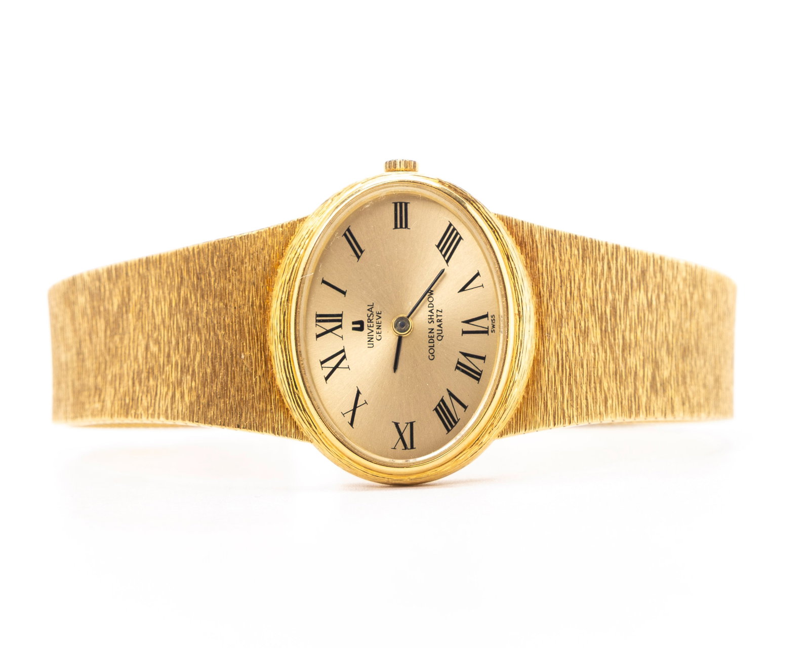 AN 18K GOLD LADIES WATCH BY UNIVERSAL GENEVE: Golden shadow, quartz.8.1" long and 81.7 grams including the movement which is not currently working