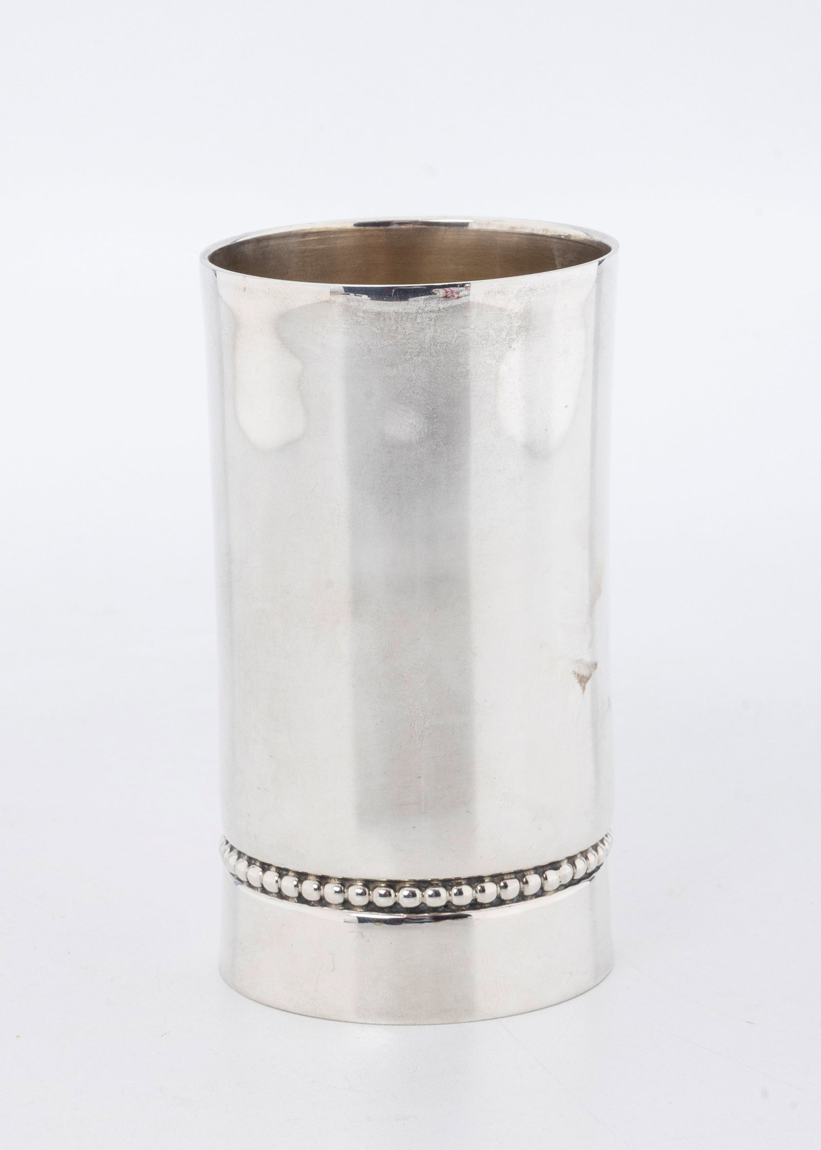 A STERLING SILVER KIDDUSH CUP BY BIER SILVERSMITHS. Israel, modern: Beaker form. With beading designs along the lower part. Marked. Excellent condition. 3.7" tall and 130.9 grams