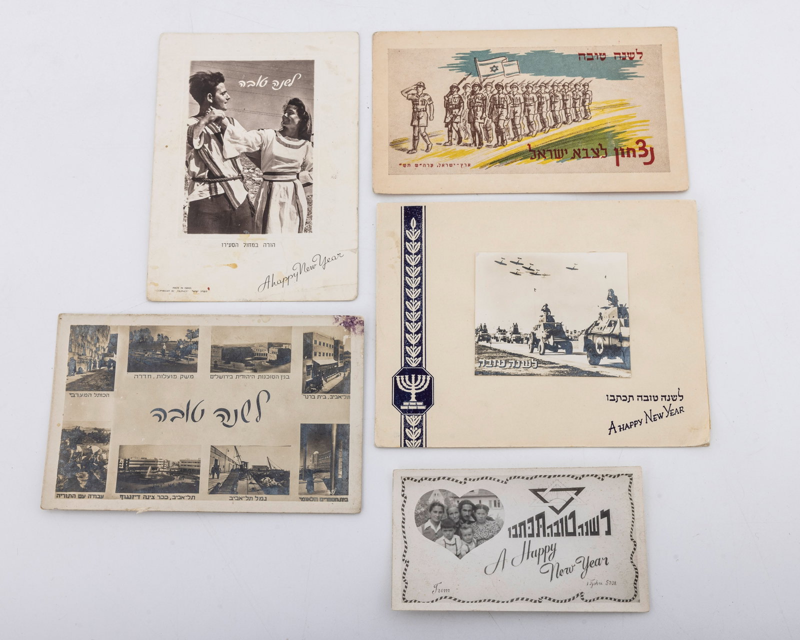 A GROUP OF FIVE EARLY ISRAEL NEW YEARS CARDS.: A rare collection of 5 different printed Happy New Years cards from the early part of Eretz Yisroel.