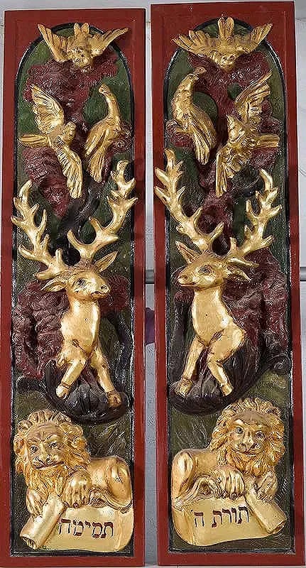 A MAGNIFICENT PAIR OF HAND CARVED TORAH ARK DOORS: A Magnificent and Rare Pair Gilded and Painted Carved Wood Torah Ark Doors. In Polish or Ukranian style. Twin lions of Judah couchant hold scrolls inscribed “The Torah of the Lord is perfect.”
