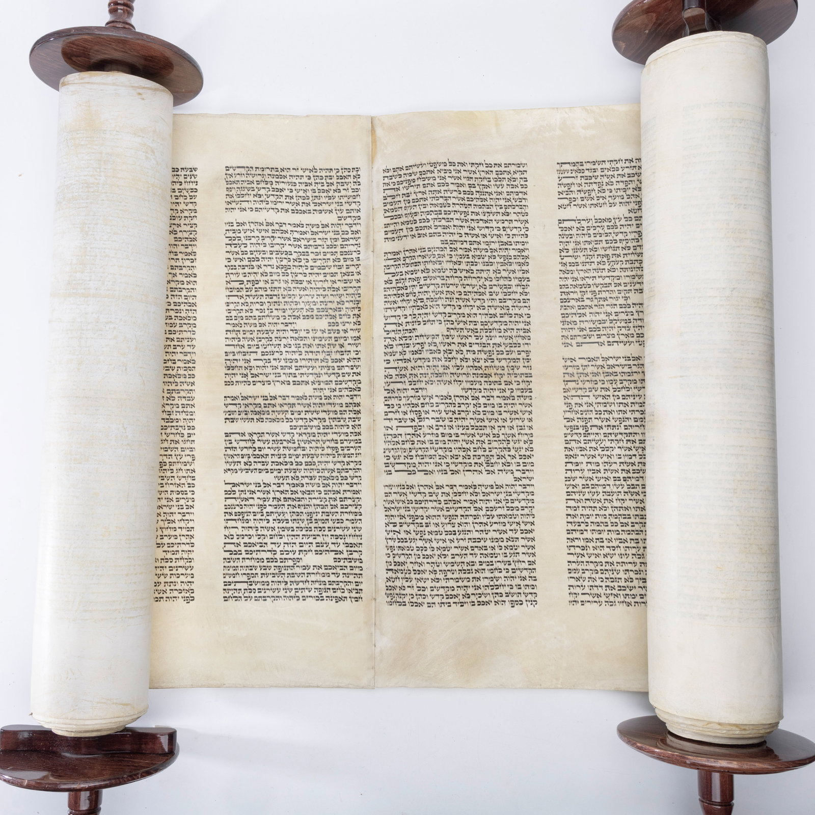 A LARGE SEFER TORAH. Ashkenaz Beis Yosef. Poland, c. 1920: Ashekenaz Beis Yosef Ksav. Has had several restorations and sprays. Mostly nice dark letters. Can possibly be made Kosher, but as of now there are some cracked letters.