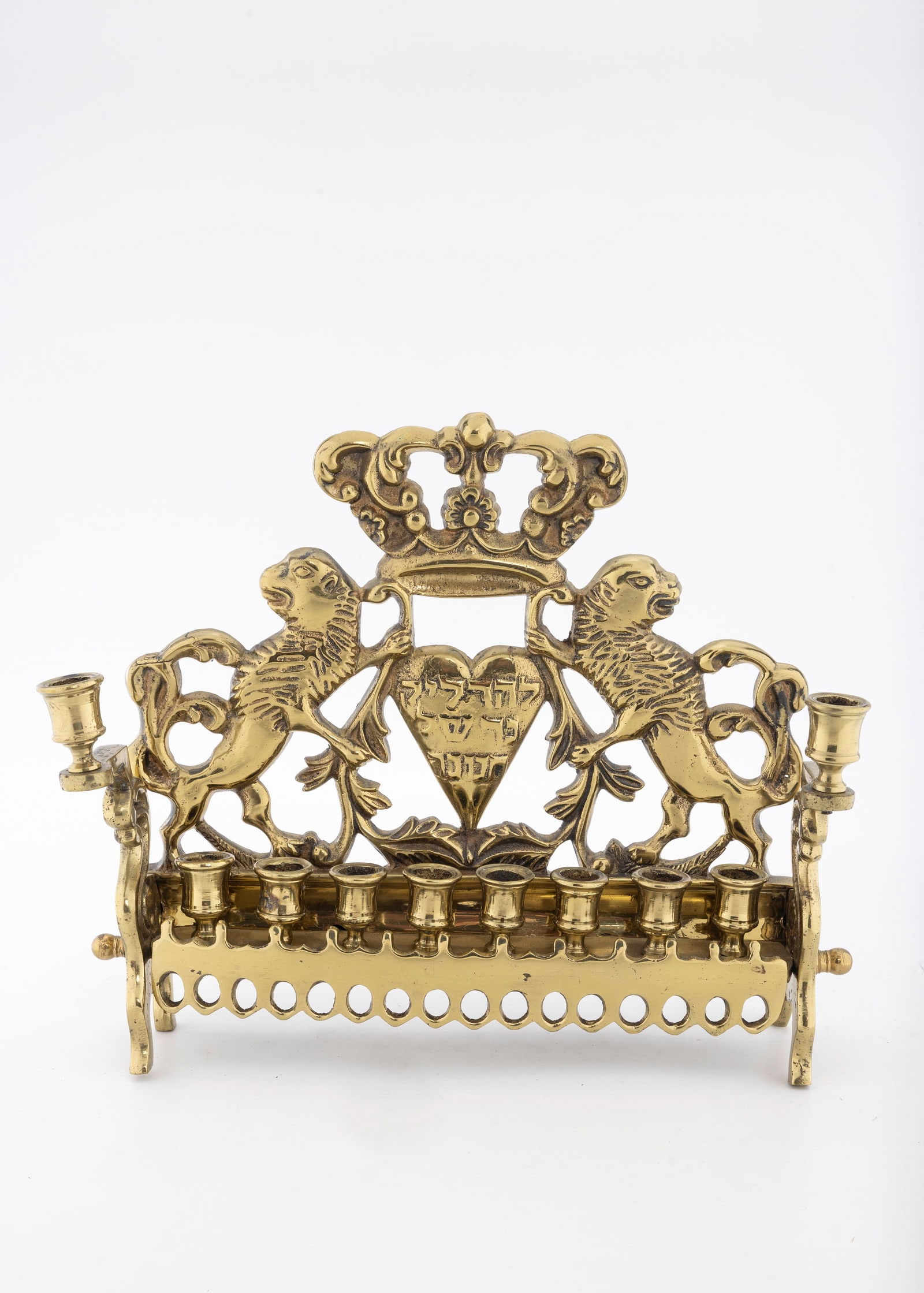 A BRASS HANUKKAH LAMP. Poland or USA, c. 1900 (1 of 1)