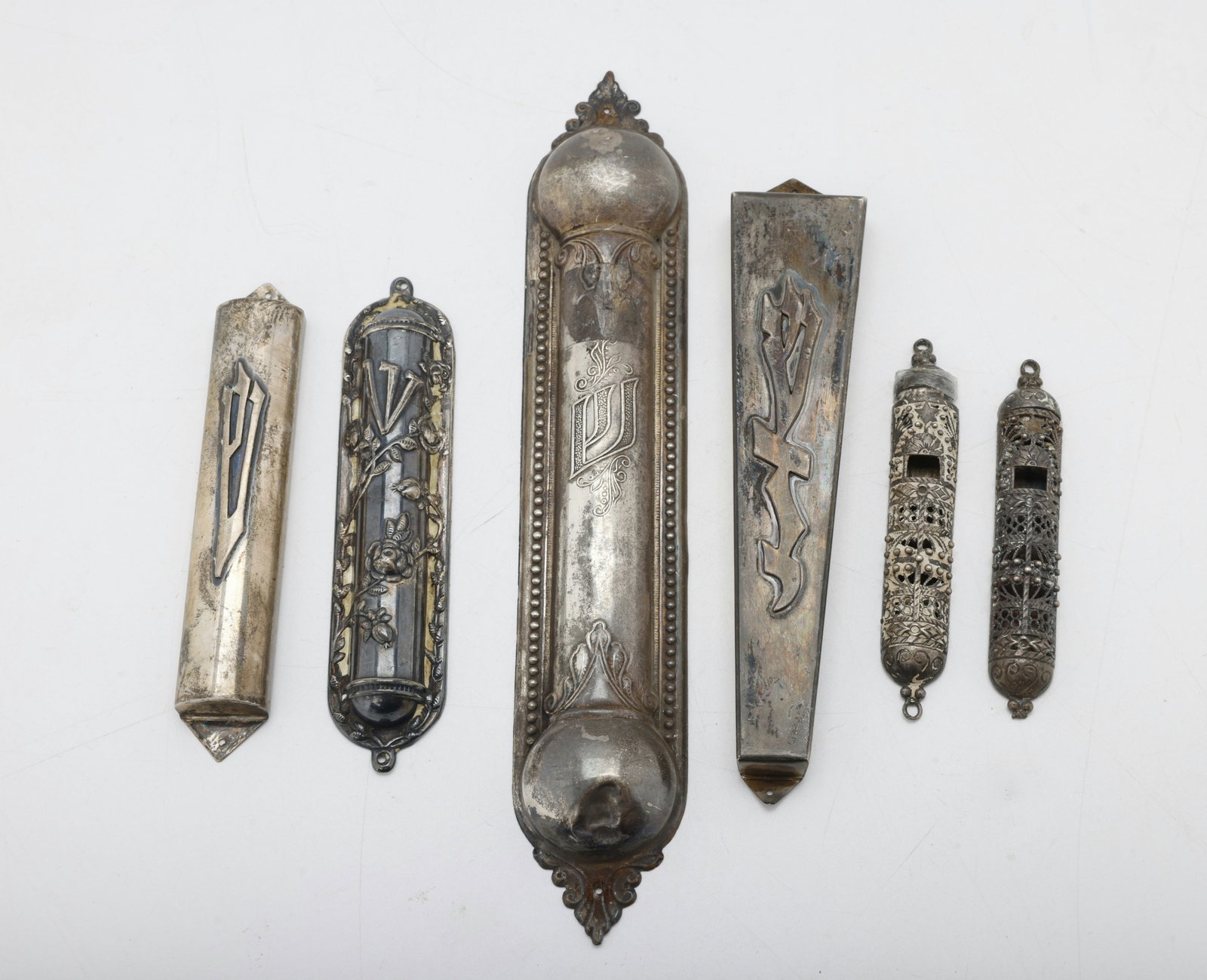 A GROUP OF STERLING SILVER MEZUZAH COVERS.: Including six mezuzah covers of various sizes. 133 grams. the largest is 7.5" long.
