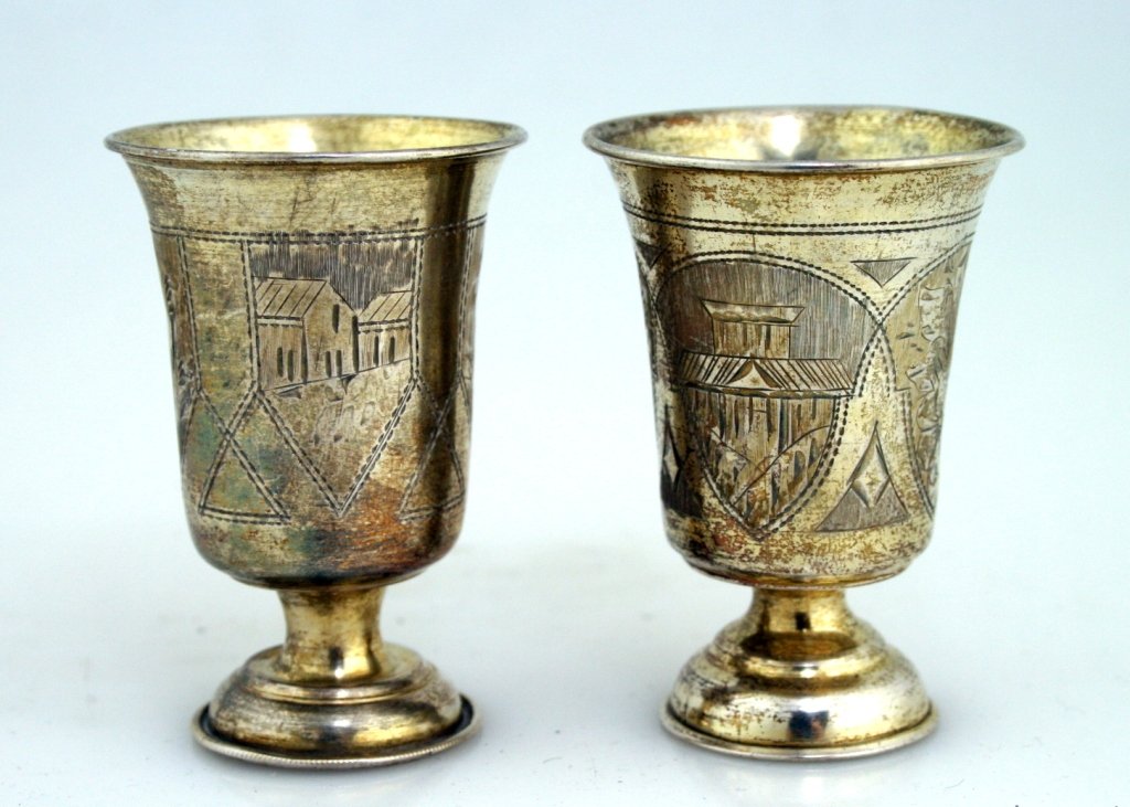 TWO SILVER BEAKERS. Russia, c. 1880. On round bases. Bo: TWO SILVER BEAKERS. Russia, c. 1880. On round bases. Both with bright cut designs. 2.5” tall.