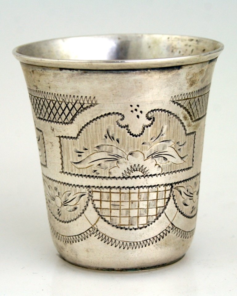 A LARGE SILVER KIDDUSH BEAKER. Russian, 1873. Bright cu: A LARGE SILVER KIDDUSH BEAKER. Russian, 1873. Bright cut design. Marked. 2.3” tall.