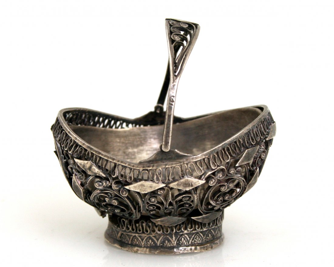 A SALT DISH. Ukraine, c. 1830. In the shape of a filigr: A SALT DISH. Ukraine, c. 1830. In the shape of a filigree basket. 2.7” wide.