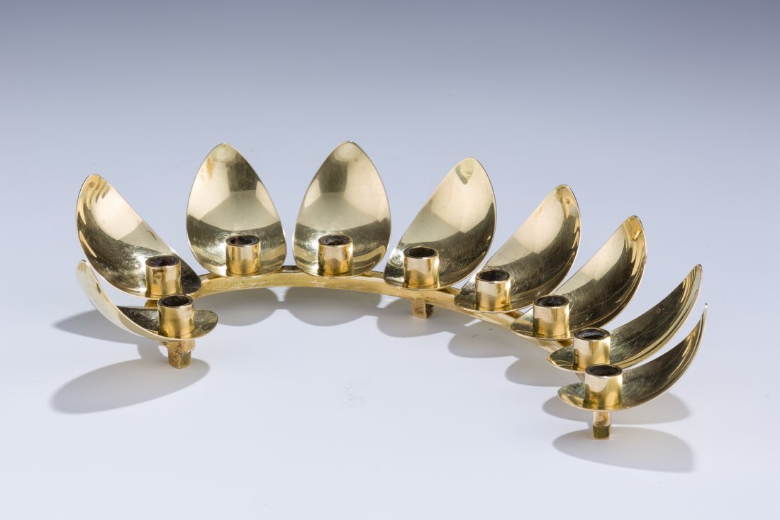BRASS CHANUKAH LAMP BY LUDWIG WOLPERT. JERUSALEM C.1950: BRASS CHANUKAH LAMP BY LUDWIG WOLPERT. JERUSALEM c. 1950. In semicircle shape. Signed Wolpert Jerusalem. 9” long. Estimate $600 – 800