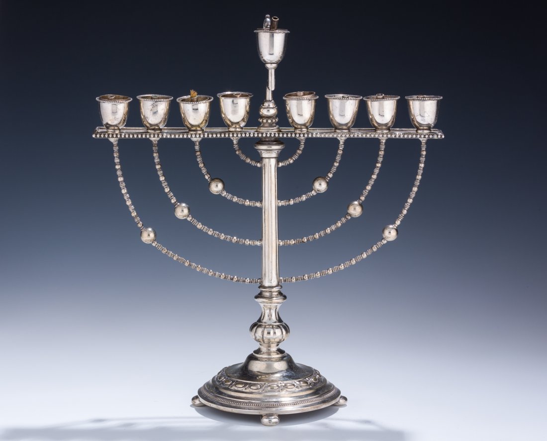 A SILVER MENORAH BY LAZARUS POSEN. Germany, c. 1900. On: A SILVER MENORAH BY LAZARUS POSEN. Germany, c. 1900. On round base with beaded design. Marked. 12.2” tall. Estimate $5,500 – 7,500