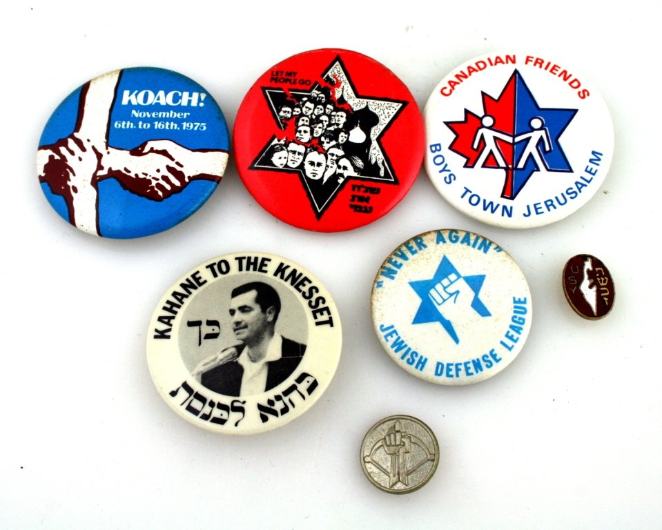A GROUP OF SEVEN JEWISH POLITICAL BUTTONS. United: A GROUP OF SEVEN JEWISH POLITICAL BUTTONS. United States, 1970's - 80's. Mostly representing the Soviet Jewry movement and Kahane related themes. Estimate $40 - 60