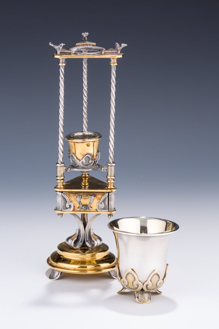 A HAVDALAH COMPENDIUM AND CUP BY DUDEK SWED. Israel,: A HAVDALAH COMPENDIUM AND CUP BY DUDEK SWED. Israel, c.1990. Made from brass and sterling silver. Marked. The compendium with removable drawer to reveal spice chamber. 8.3” tall on compendium and 2.