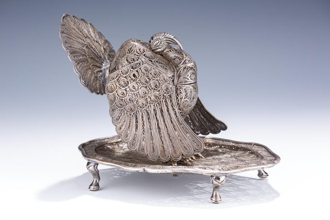 A LARGE SILVER CONTAINER. South American, 20th century.: A LARGE SILVER CONTAINER. South American, 20th century. In the shape of a turkey on a dish. Completely made of filigree. Lead solder repair to tail. 6” tall. Estimate $2,000 – 3,000