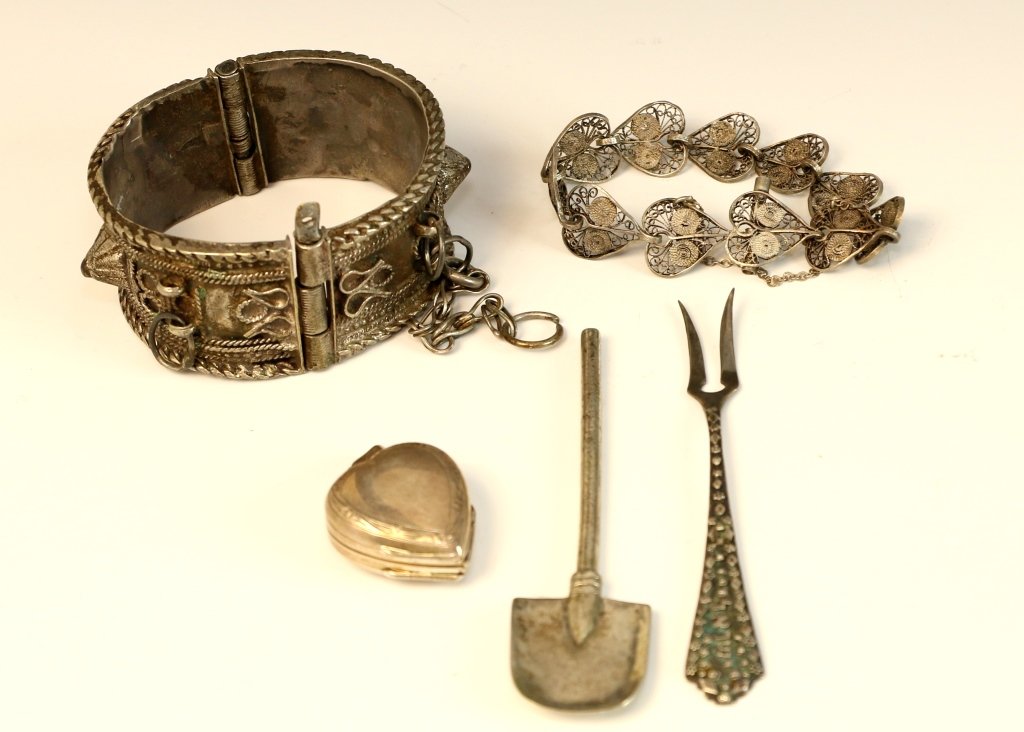 A GROUP OF SMALL SILVER OBJECTS. Various makers.: A GROUP OF SMALL SILVER OBJECTS. Various makers. Including a fork marked Israel, a middle eastern bracelet a sugar shovel and a locket.