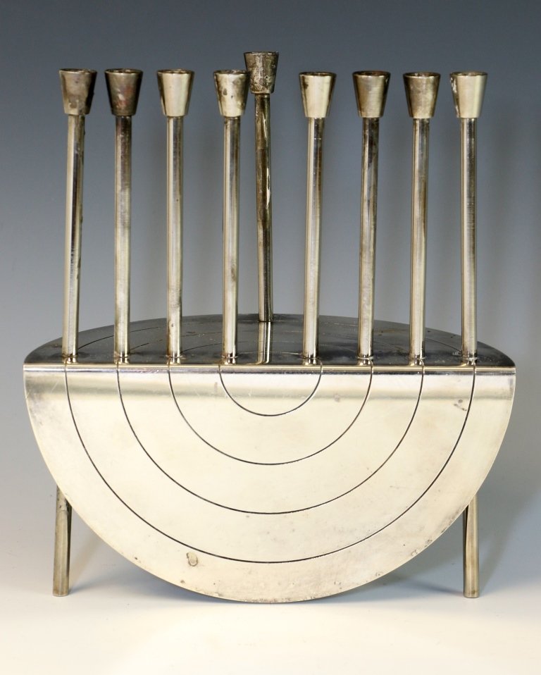 A SILVERPLATED CHANUKAH MENORAH. Israel, c. 1990. In: A SILVERPLATED CHANUKAH MENORAH. Israel, c. 1990. In modernist form. Hand signed in Hebrew. 7.7” tall.