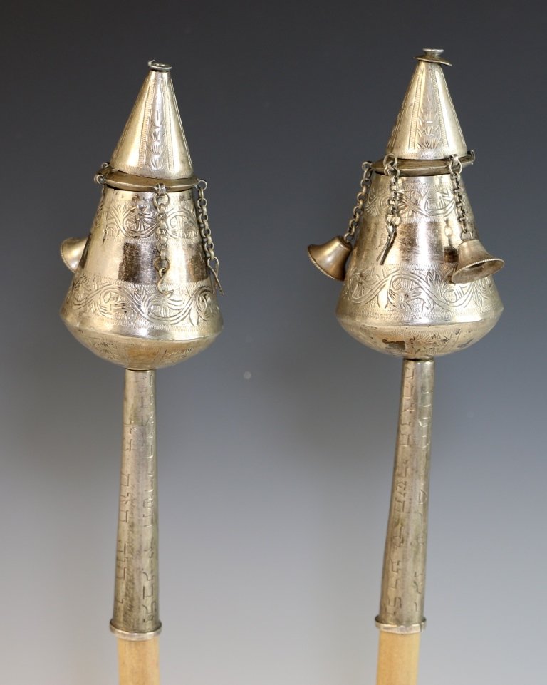 A PAIR OF SILVER TORAH FINIALS. North Africa, c. 1880.: A PAIR OF SILVER TORAH FINIALS. North Africa, c. 1880. Engraved on stave; “LEILU NISHMAT SHLMOM CHAZRATH NILBAH, 14 OF TISHRAY”. 8” tall.