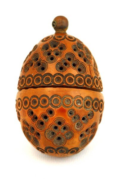 AN OLIVEWOOD SPICE CONTAINER. Palestine, c. 1910. In: AN OLIVEWOOD SPICE CONTAINER. Palestine, c. 1910. In theshape of an egg. 3” tall. Estimate $75 – 125
