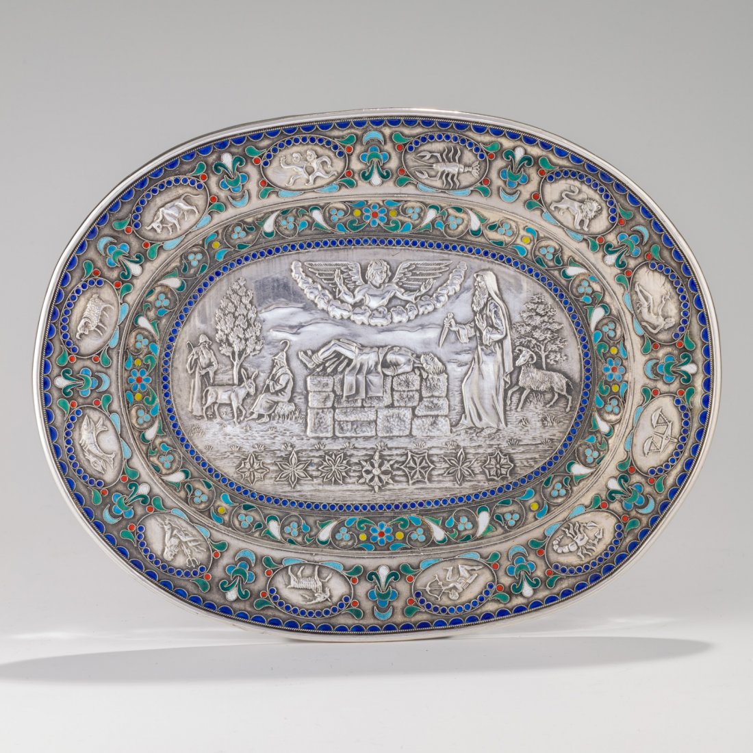 A SILVER AND ENAMEL PIDYON HABEN TRAY BY HENRYK: A SILVER AND ENAMEL PIDYON HABEN TRAY BY HENRYK WINOGRAD. New York, c. 1990. Decorated with the scene of the binding of Isaac. 9.6” x 7.5”.