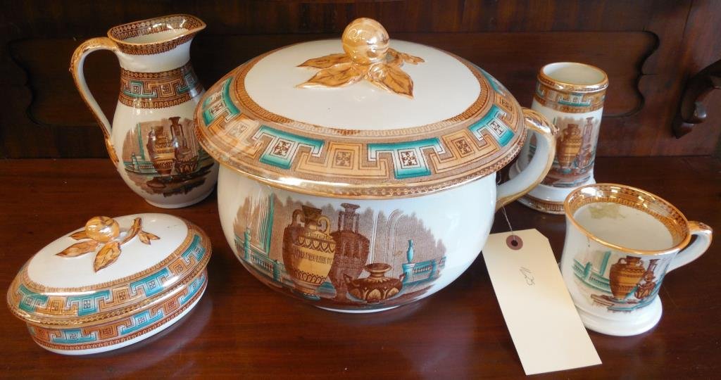 Porcelain Chamber Collection, 5 Pieces: Transfer Decorated, Egyptian Influence, (1) Thunder Jug, Lidded, 9" X 11", (1) Shaving Mug, H3 1/2", (1) Lidded Soap, H 3 1/2", (1) Brush Collector, H 5 1/2", (1) Pitcher H 7"