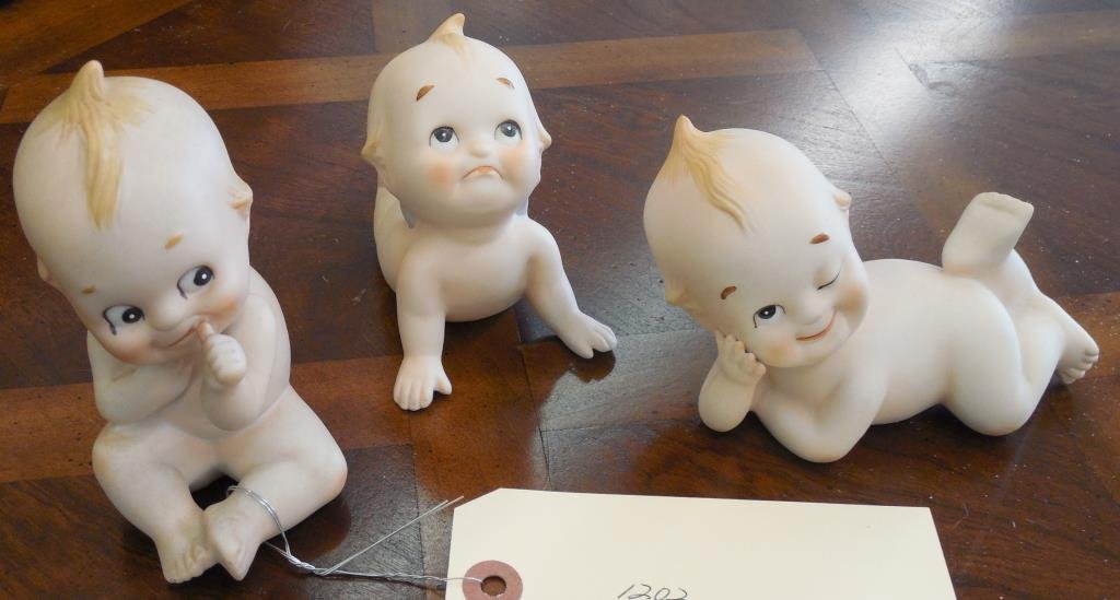 Kewpie Doll Collection, 3 Pieces: (1) Winker, H 3", (1) Thumb Sucker, H 5", (1) Pouter, H 3 1/2"