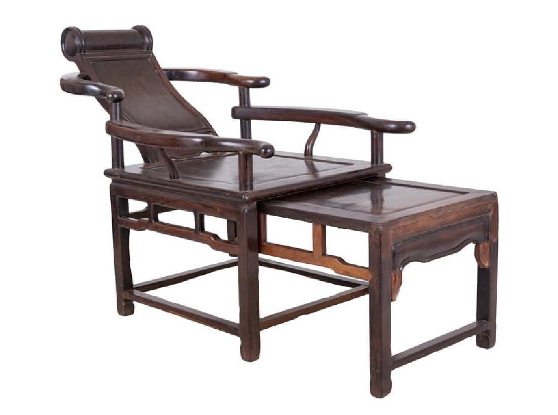 CHINESE HARDWOOD "MOON VIEWING" CHAIR: with sliding footstool Provenance: The Estate of John Robert Weber