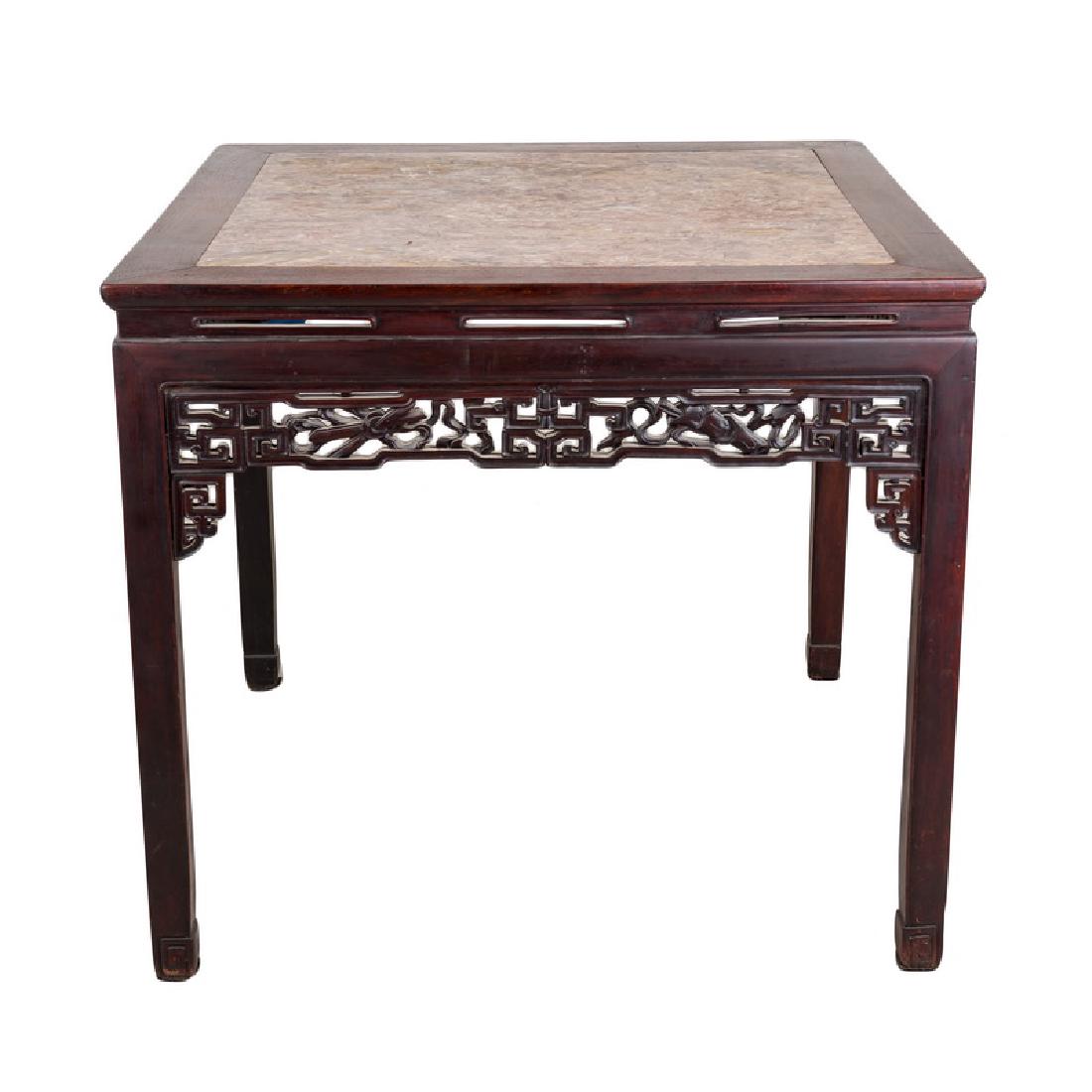 SQUARE CARVED HARDWOOD CHINESE GAME TABLE: with inset pink marble top Provenance: The Estate of John Robert Weber 38 3/4 inches square; 34 1/2 inches high