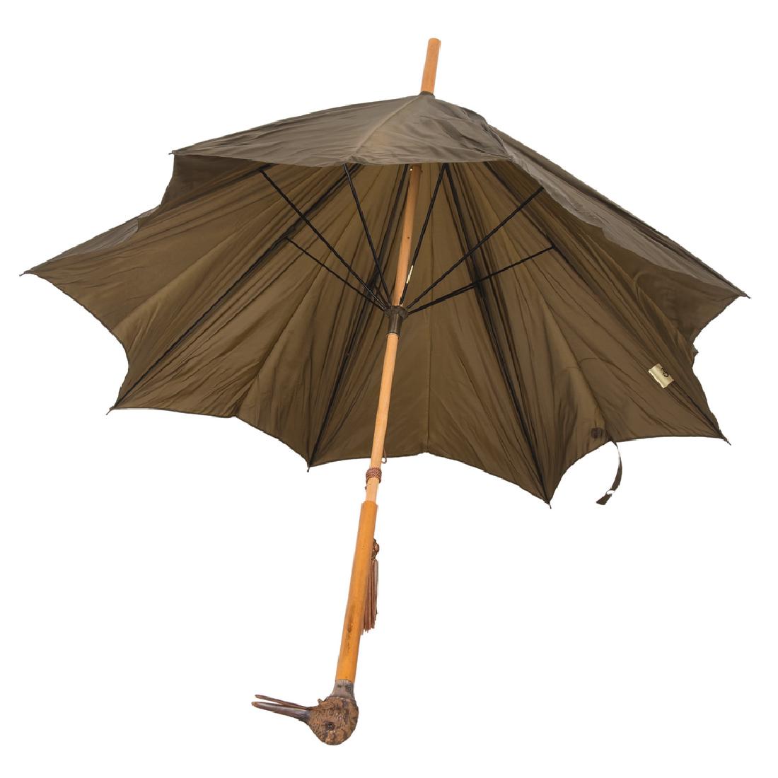 JAMES SMITH & SONS DUCK-HANDLED UMBRELLA WITH MOVABLE: hardwood handle with carved bird containing movable jaw Condition: some chips to base 39 inches