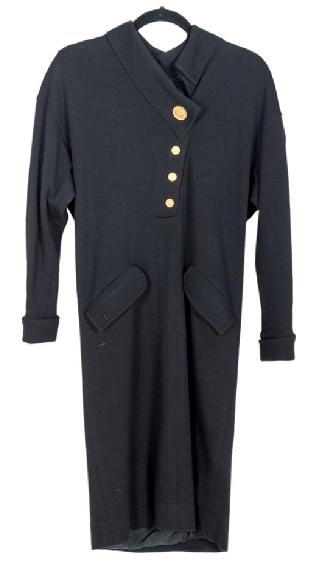CHANEL BLACK WOOL DRESS WITH GOLD BUTTONS: with long sleeves and collar and having Coco Chanel coin buttons and two slant pockets; lined. length: 41 inches; bust: 36 inches