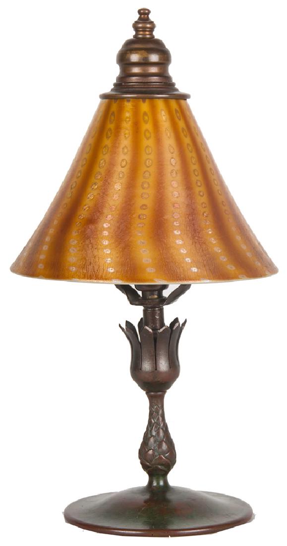 TIFFANY STUDIOS CANDLESTICK BOUDOIR LAMP: the shade marked 'L.C.T;' the base, inscribed 'Tiffany Studios, New York' and numbered 1043 13 inches high