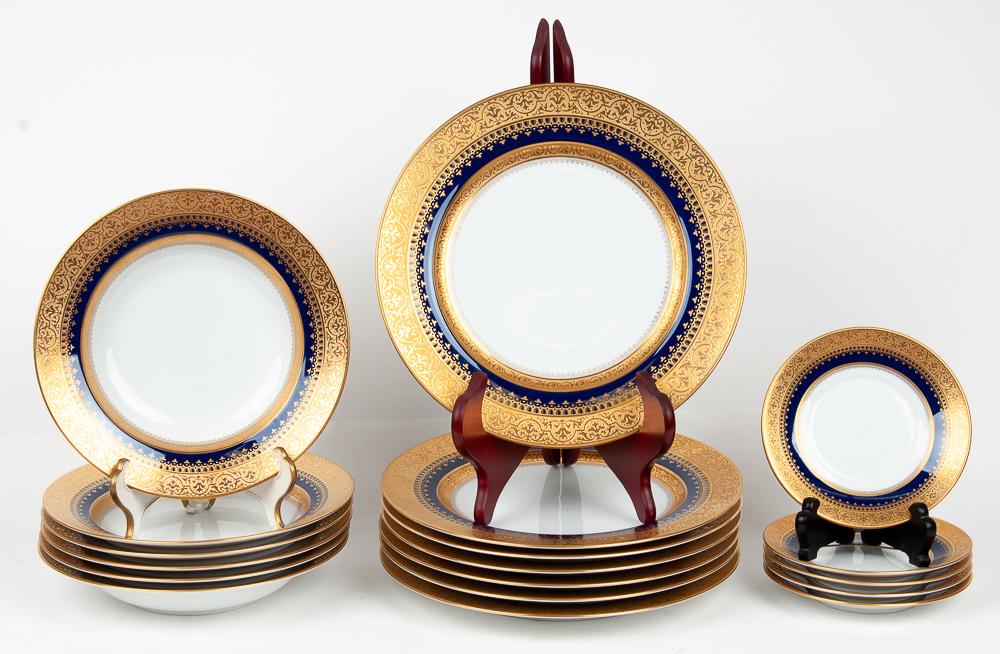 FABERGE PORCELAIN DINNER SERVICE: Imperial Heritage pattern comprising 25 service plates, 16 bread plates, 15 soup bowls, one platter, 24 salad plates, 14 cups & 16 underplates, and an oval platter together with 14 Imperial Egg demita