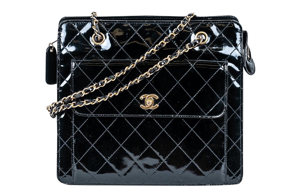 CHANEL BLACK PATENT LEATHER QUILTED BAG: with exterior pocket and gold-tone hardware Condition: with scuffs to leather at bottom corners 11 3/4 inches wide; 4 1/2 inches deep; 10 1/4 inches high