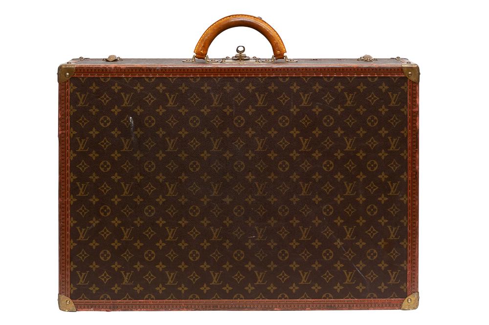 LOUIS VUITTON HARD CASE SUITCASE: with monogram initials Condition: with scuffs to monogram and discoloration 25 3/5 inches wide; 6 3/4 inches deep; 17 1/2 inches high