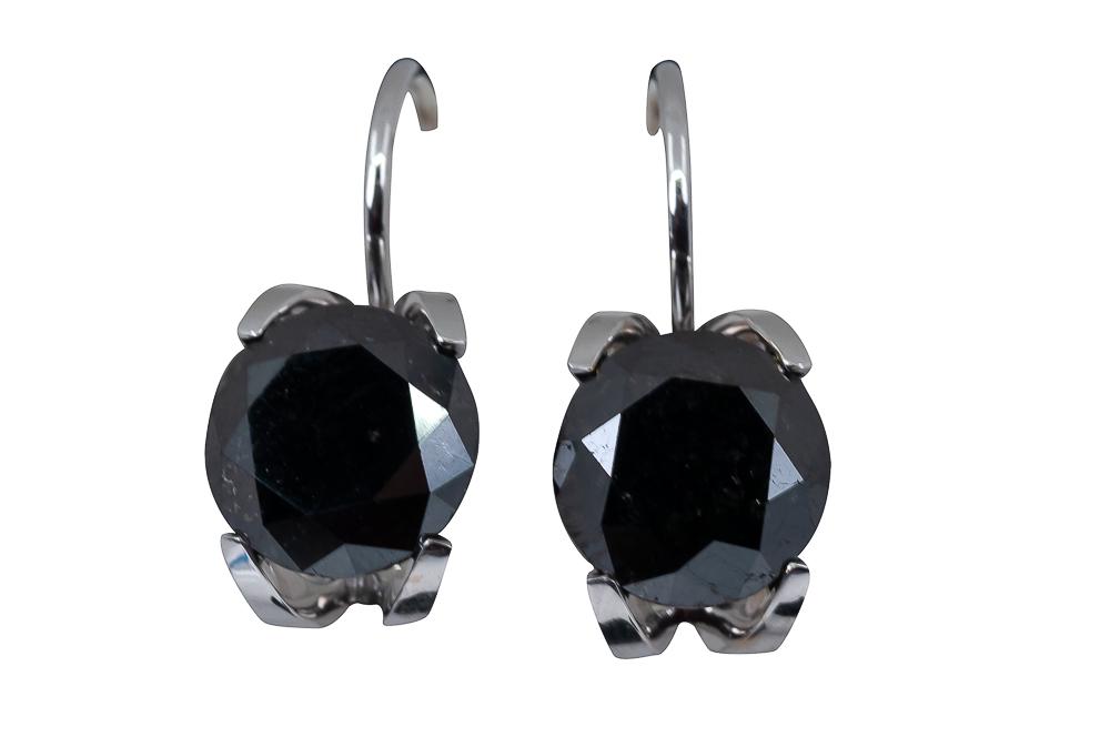 PAIR OF 18 KARAT WHITE GOLD & BLACK DIAMOND EARRINGS: containing two black round brilliant diamonds, one weighing 2.75 carats, the other, 2.83 carats 6.1 grams 21 x 8 mm