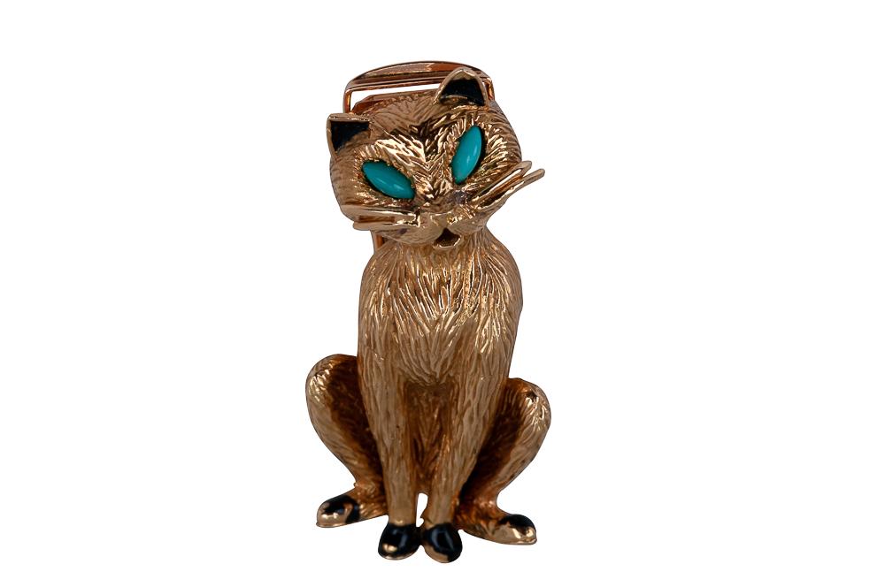 CARTIER 18 KARAT GOLD, TURQUOISE, & ENAMEL CAT BROOCH: sitting cat brooch with black enamel accents, containing two marquise cabochon cut natural turquoises, weighing 0.10 carats total 17.9 grams 17.9 grams