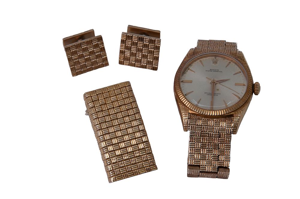 ROLEX 18 KARAT YELLOW GOLD OYSTER PERPETUAL WATCH WITH: the 18 karat yellow gold Rolex oyster perpetual wristwatch having an attached 14 karat yellow gold bracelet with basket weave finish, 31.00 mm round silver dial with fluted bezel, case engraved 'Theod