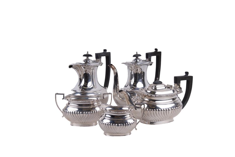 ELIZABETH II SILVER-FOUR PIECE TEA & COFFEE SERVICE: William Bush & Sons, Sheffield, 1963 comprising of a coffee pot, teapot, creamer & sugar together with a similar coffee pot by same maker circa 1961 98 total troy ounces, including handles each coffee