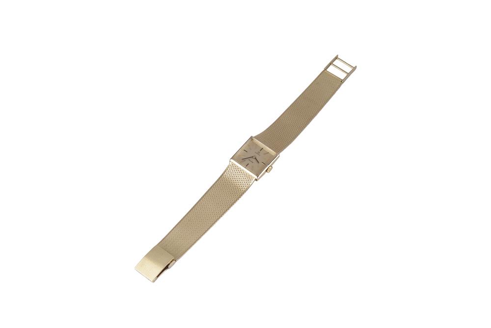 OMEGA 18 KARAT GOLD LADIES WATCH: with mesh link bracelet 52.8 grams; with two additional links weighing 2.3 grams Condition: working order 6 3/4 inches long