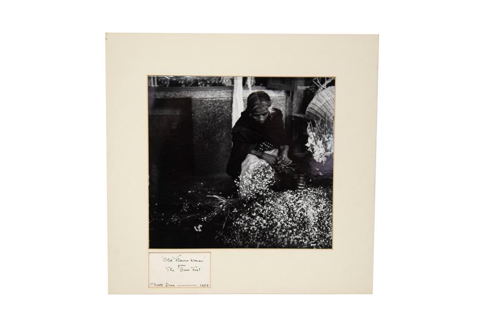 NELL DORR: "OLD FLOWER WOMAN FROM THE BARE FEET": silver gelatin print signed lower left 10 1/2 x 11 1/2 inches