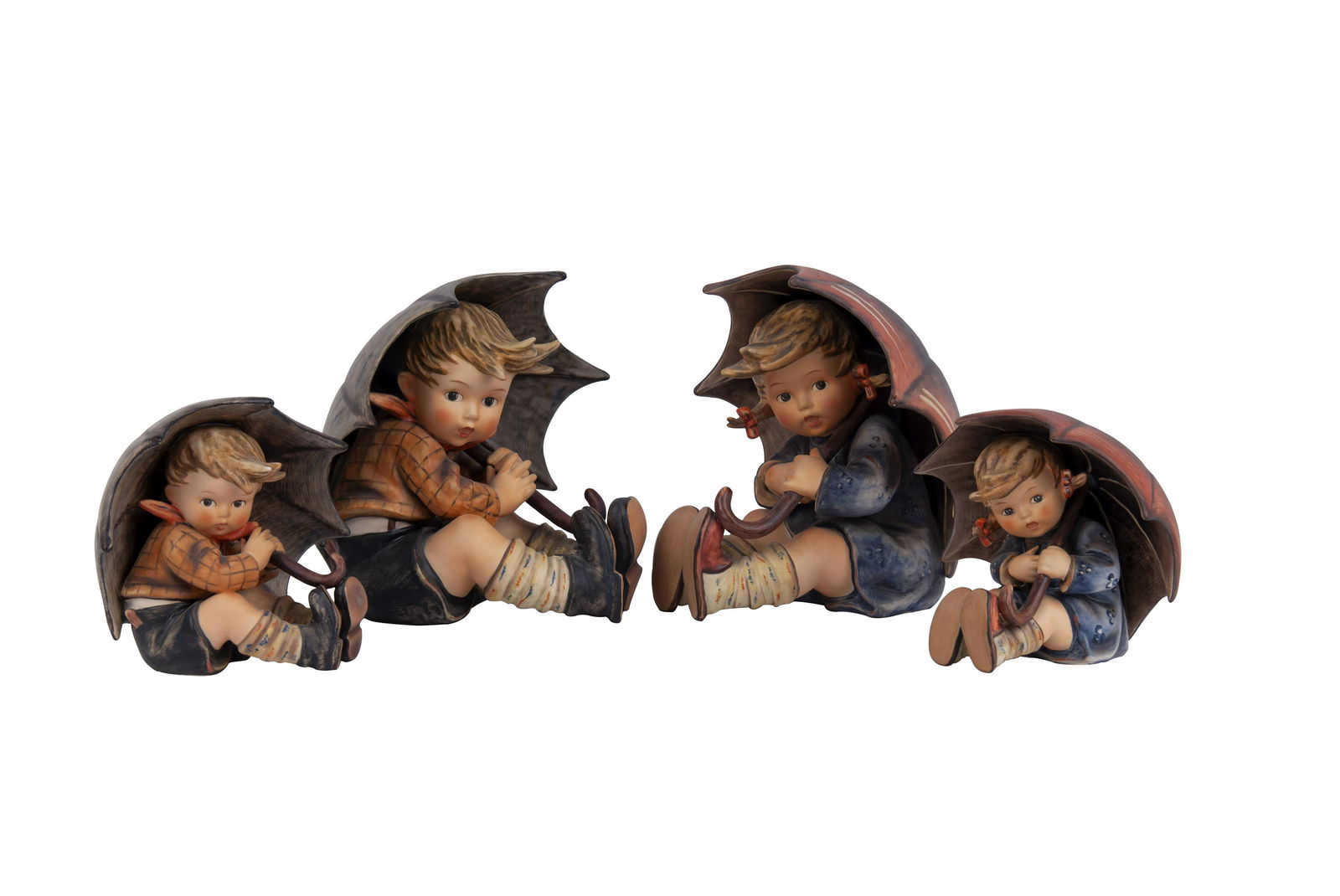 TWO PAIRS OF GOEBEL FIGURES: 'UMBRELLA BOY & GIRL': Condition: Good; with wear to bottom the large size: 7 1/2 in. wide x 7 3/4 in. high; the small ones: 5 in. wide x 5 1/2 in. high