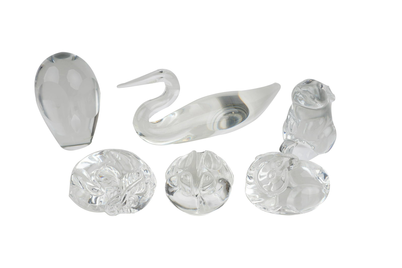 FIVE STEUBEN TABLE ITEMS: comprising a duck, an owl, and three hand warmers together with a Baccarat rabbit [6 items total] Provenance: The Estate of Judith Sterling Morse Plunkett the duck: 8 1/2 inches long