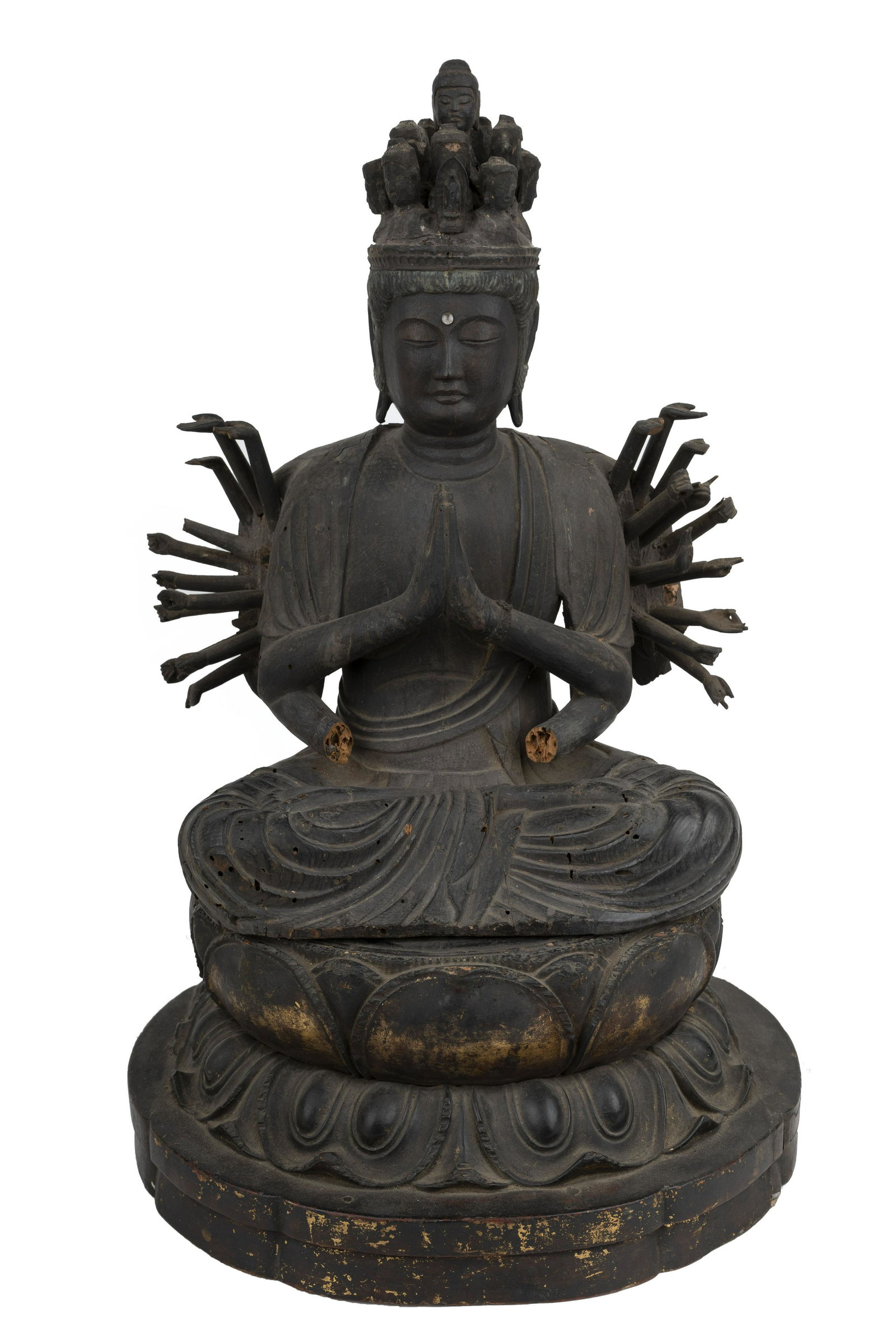 JAPANESE CARVED WOOD DEITY: resting on a wood carved lotus base Condition: with loss and damage throughout 13 1/2 inches high; 18 total inches high