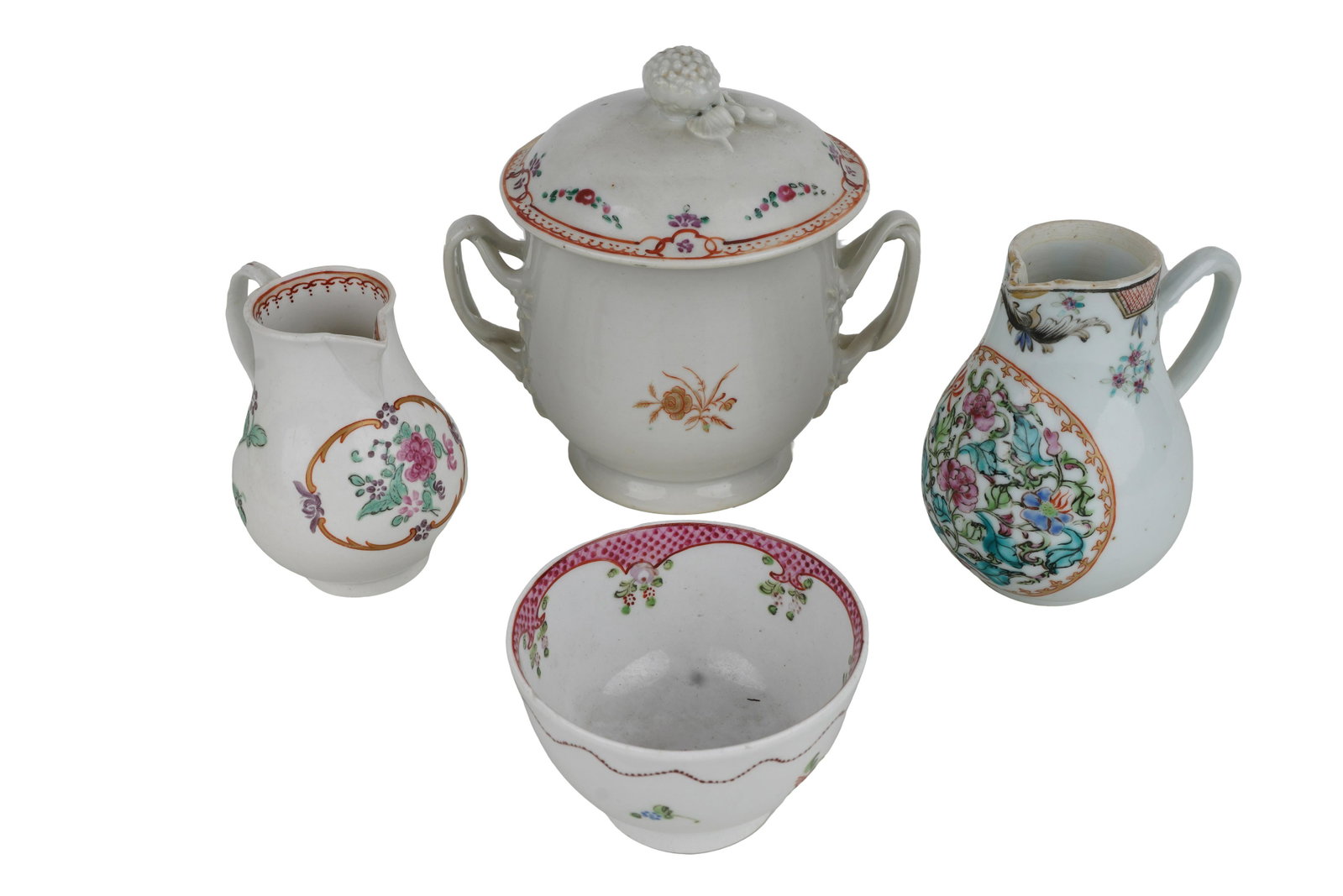 FOUR CHINESE EXPORT PORCELAIN TABLE ITEMS: comprising a covered vessel, two cream jugs, & a tea bowl Provenance: The Estate of Judith Sterling Morse Plunkett