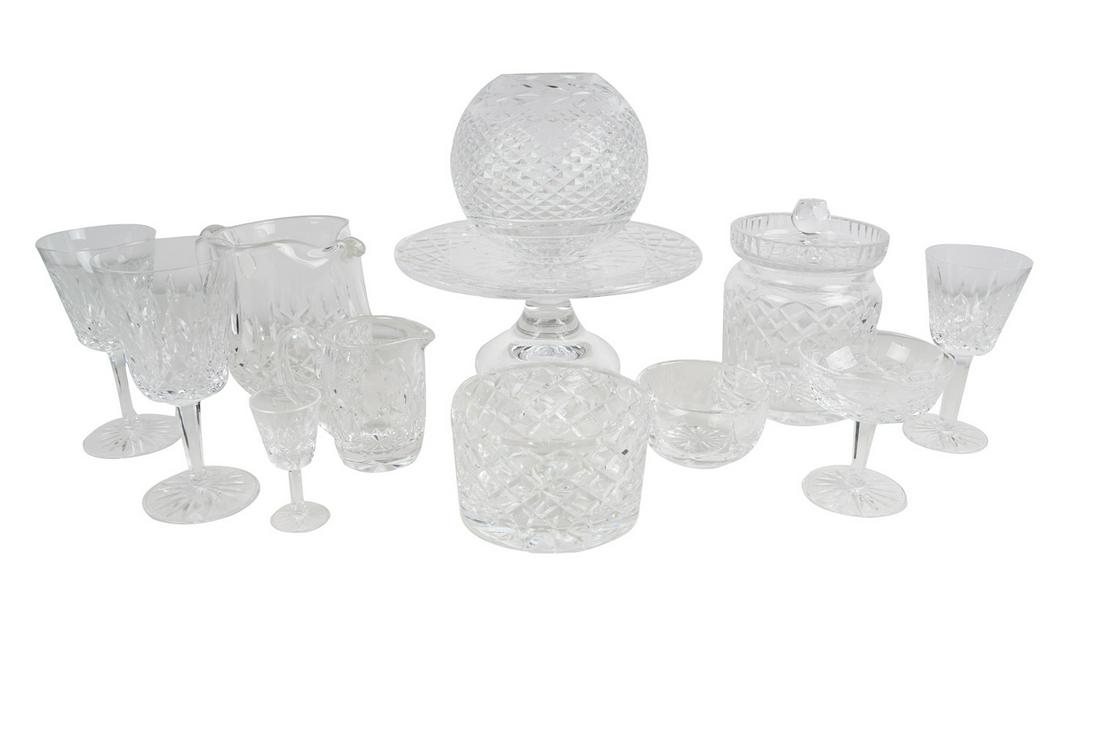 COLLECTION OF WATERFORD CRYSTAL: comprising 12 water glasses, 12 wine glasses, 11 champagne coupes, 7 cordials, water pitcher, biscuit jar, creamer & sugar bowl, spherical flower bowl, circular flower bowl, covered candy dish, & a ca