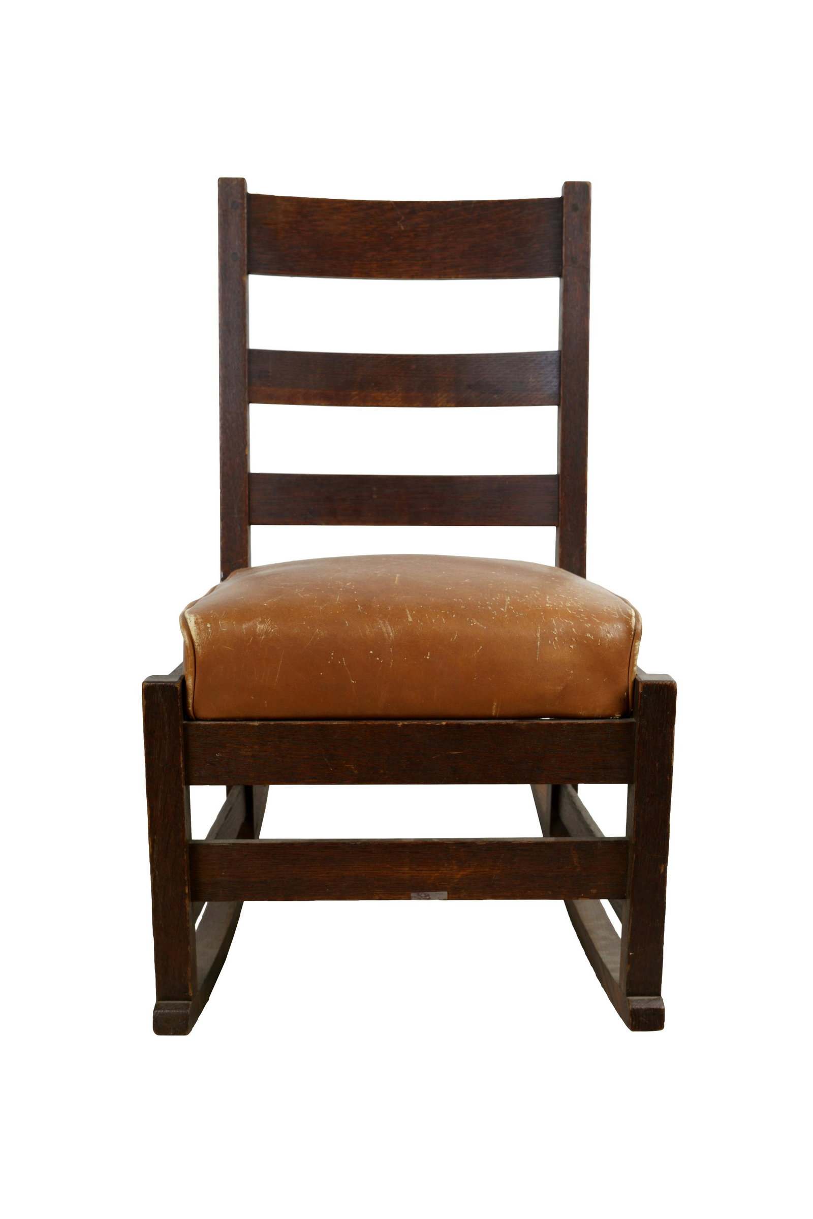 ARTS & CRAFTS ROCKER: with detached leather cushion Condition: wear to leather with minor scratches to wood height to back: 31 inches high