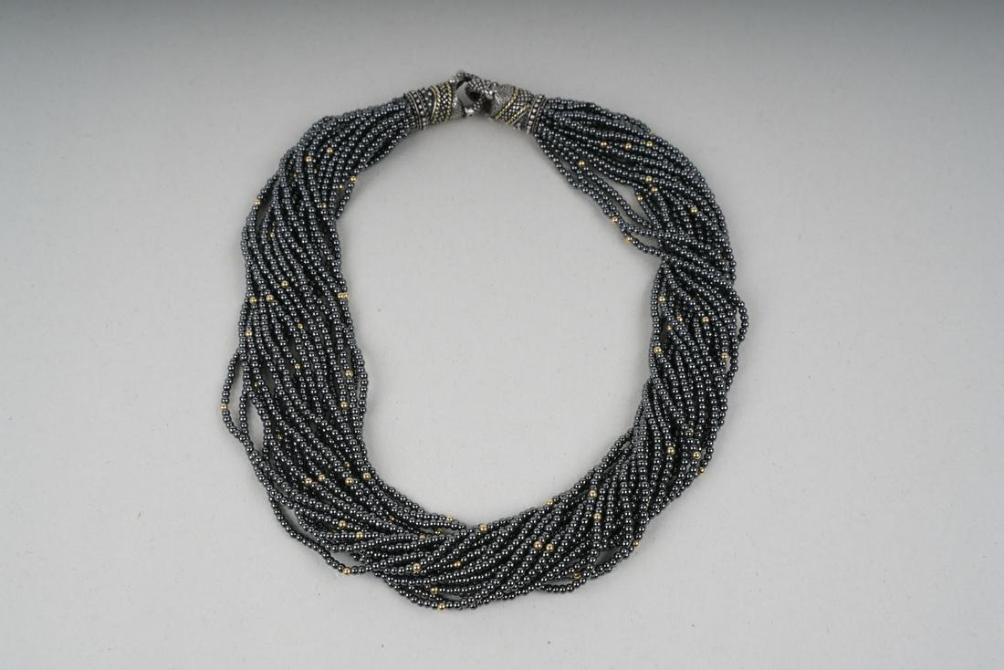 18 KARAT GOLD, STERLING, & HEMATITE BEAD TORSADE: consisting of 20 uniform strands containing approximately 4,000 drilled spherical natural hematite beads, accented with 120 drilled spherical 18 karat yellow gold beads Provenance: Denver, CO Estate 1