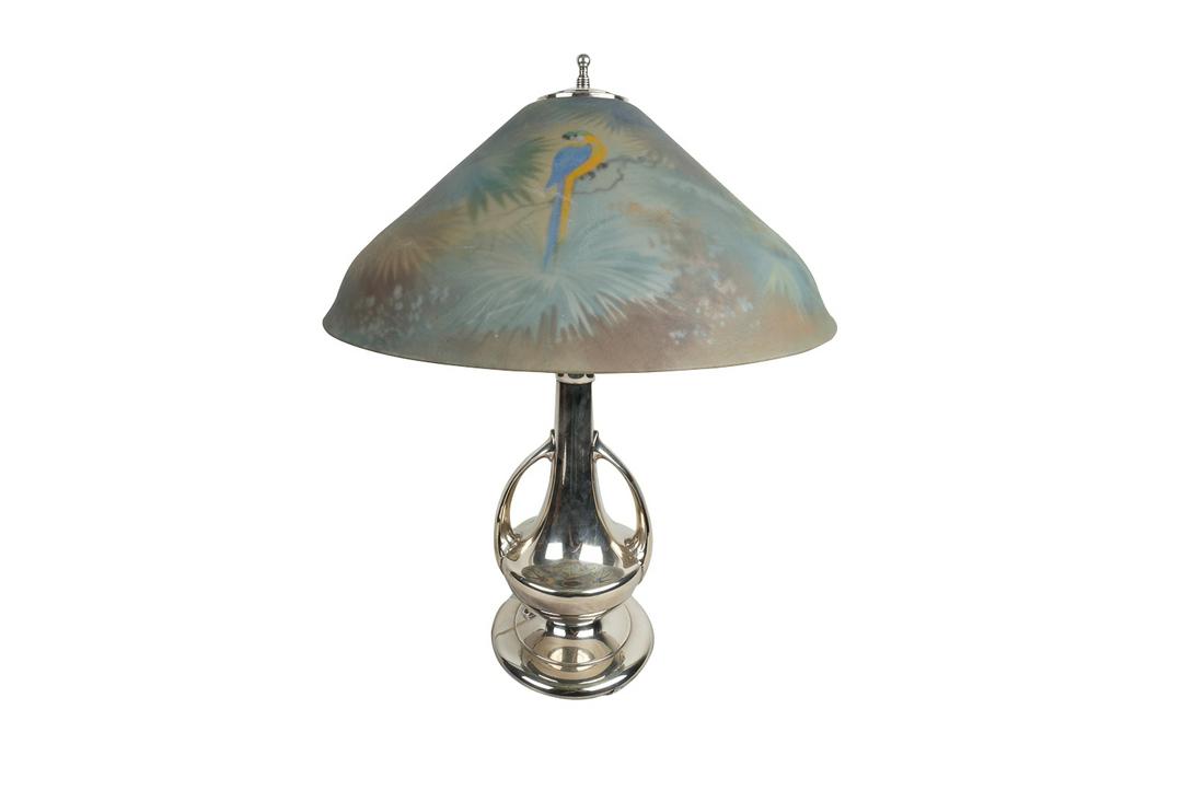 PAIRPOINT REVERSE-PAINTED SHADE TABLE LAMP: the shade signed, the base stamped and numbered D3034 made in the U.S.A, the shade decorated with parrots and tropical foliage Provenance: The Douglas & Eunice Goodan Living Trust Condition: with no c