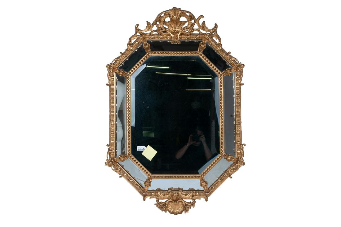 FRENCH RENAISSANCE STYLE GILTWOOD MIRROR: with a beveled cushion frame 56 x 37 inches