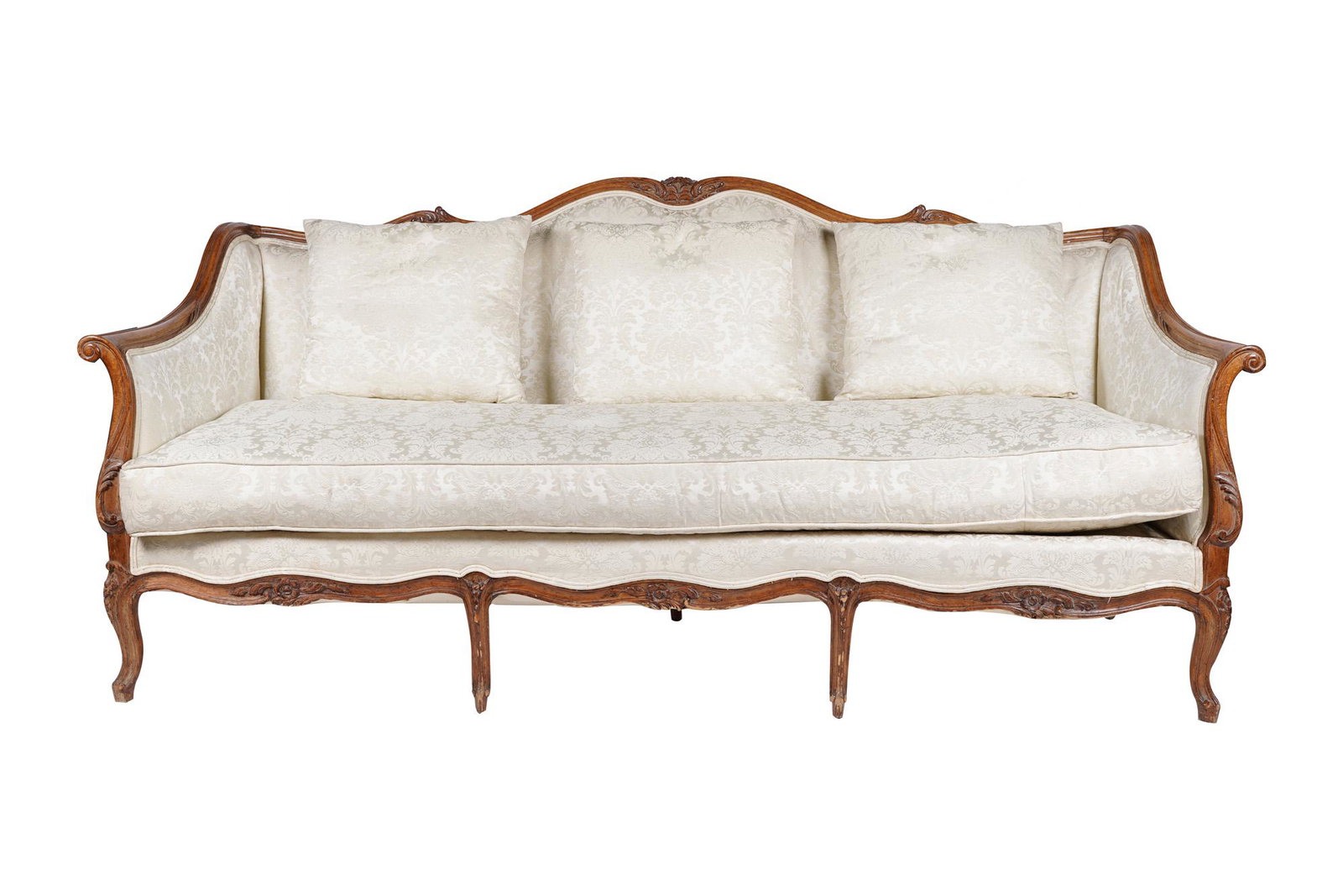 FRENCH PROVINCIAL WALNUT CANAPE: early 20th century covered in cream-colored floral damask Condition: good minor wear to frame. Upholstery clean and in useable condition. 80 inches wide; 29 inches deep; 35 1/2 inches high; seat heigh